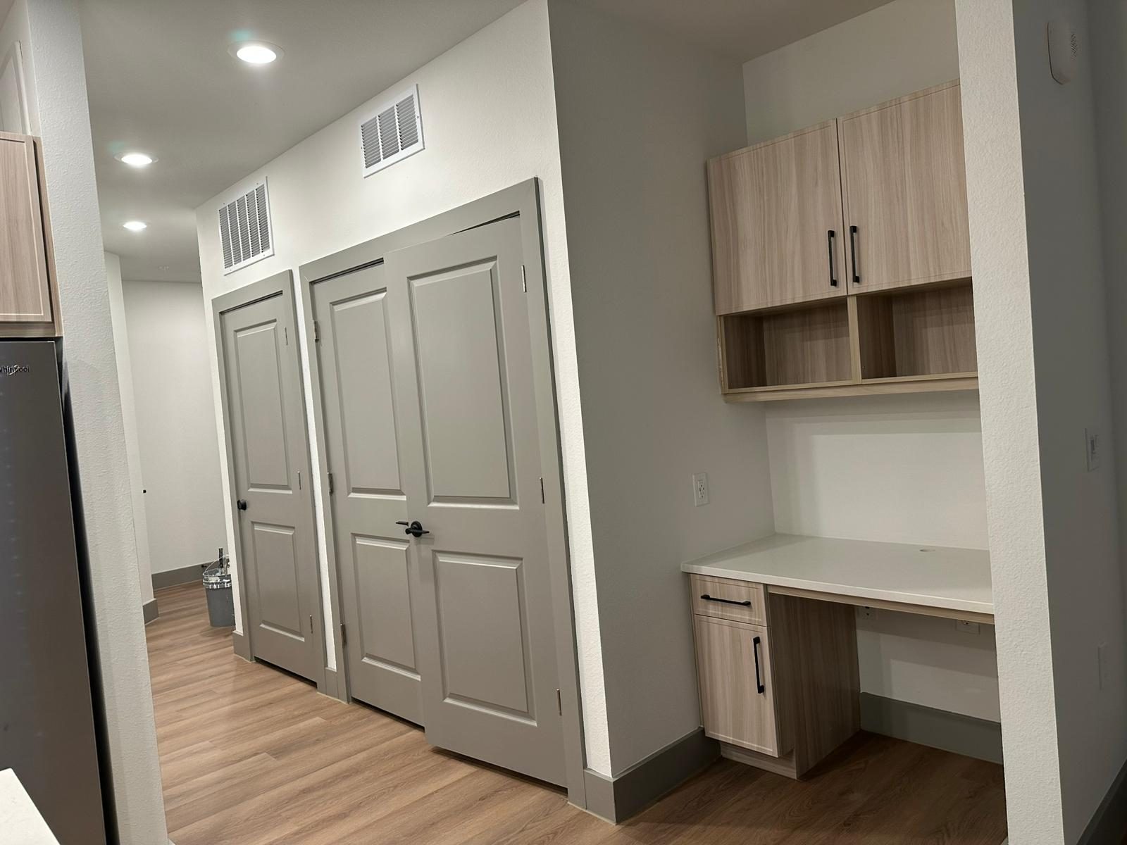 Finished apartment hallways, doors and millwork