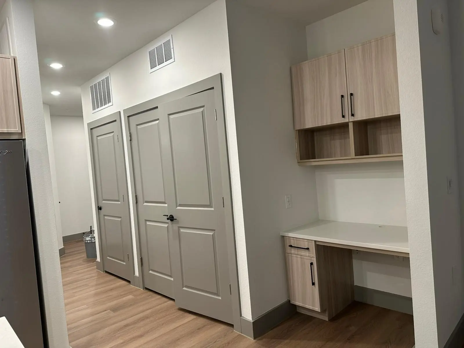 Finished apartment hallways, doors and millwork