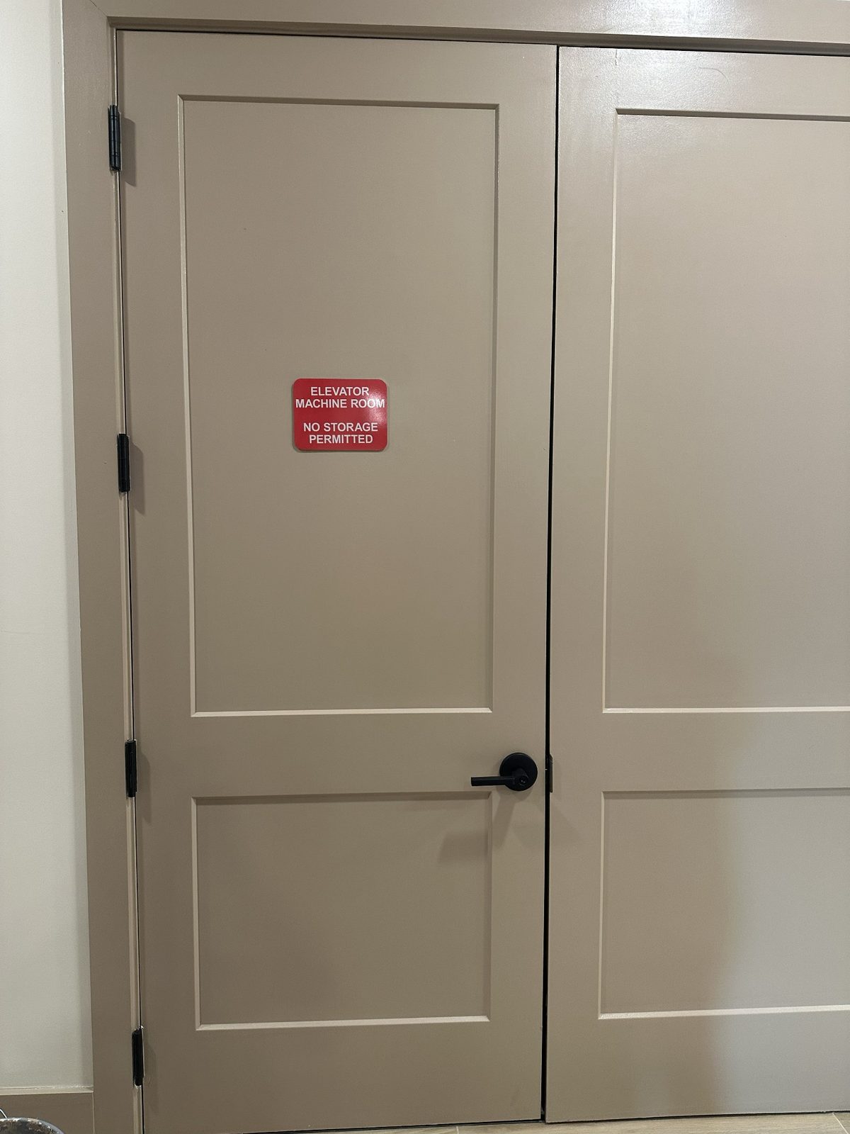 Finished commercial door repainting and restoration