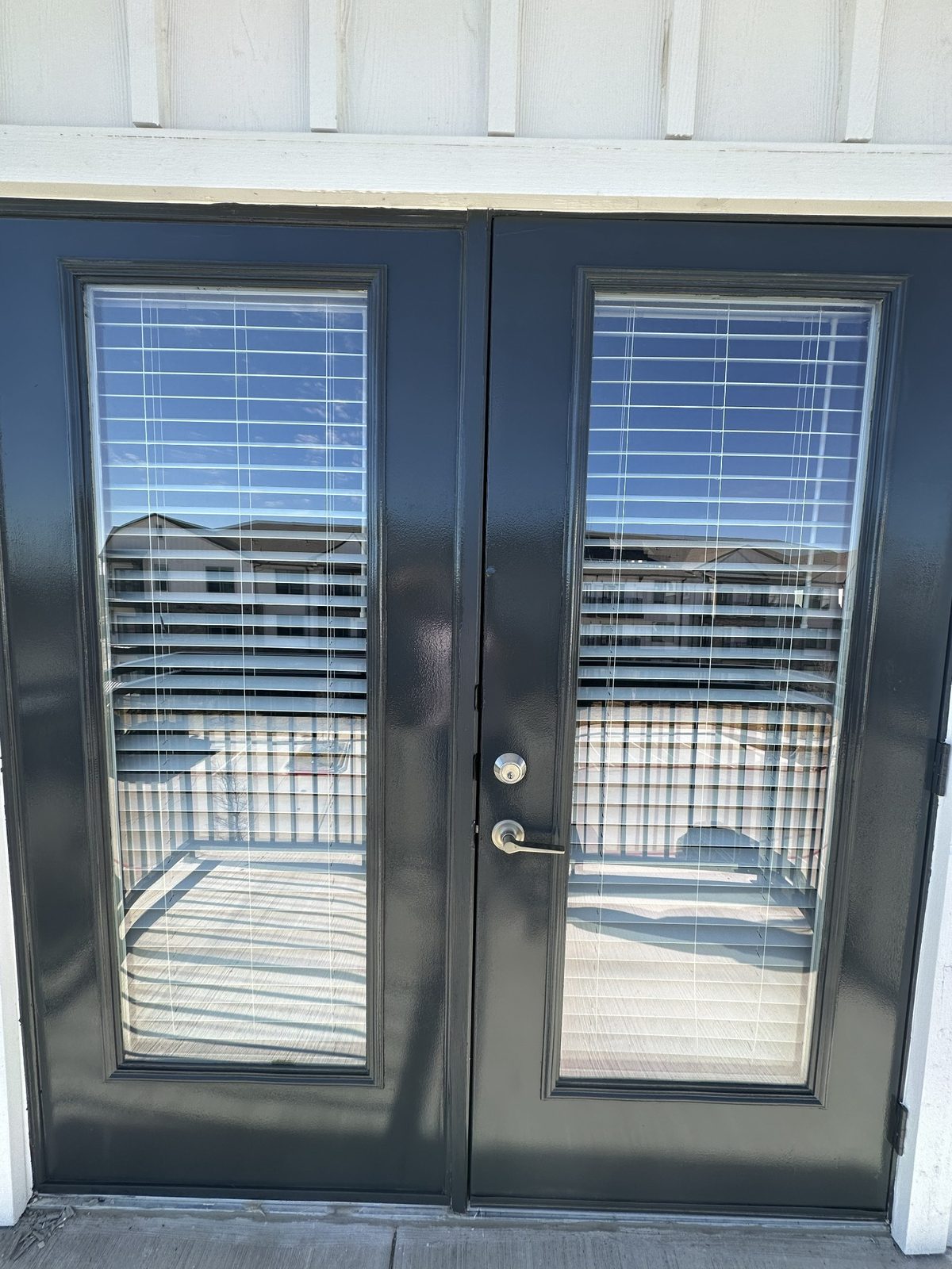 Finished exterior door painting with glass panels