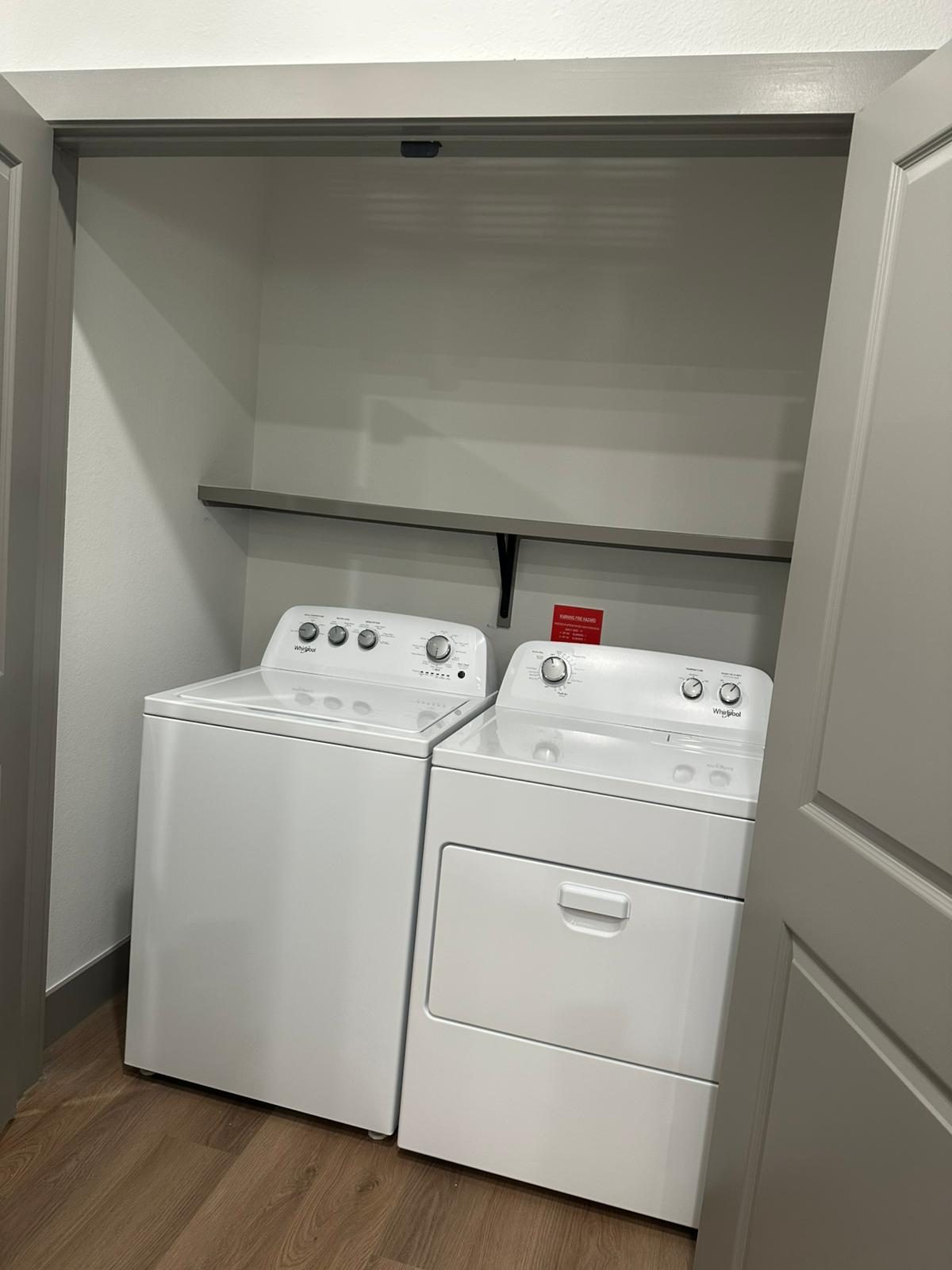 Finished laundry room paint and shelving